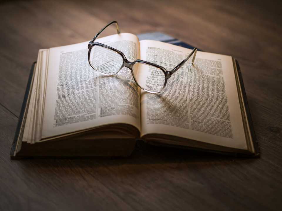 book with glasses